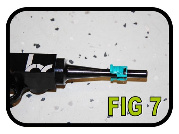 Remove the blue quick disconnect clip from the OEM fuel rail and slide it onto the –8 to 5/16 quick disconnect union as illustrated in FIG 7.