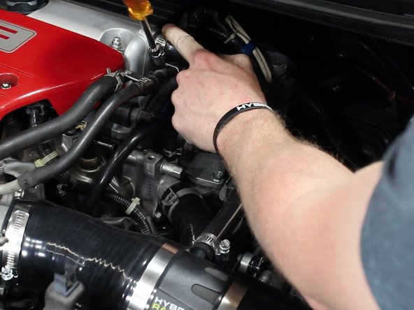 Install and tighten the valve cover breather tube.