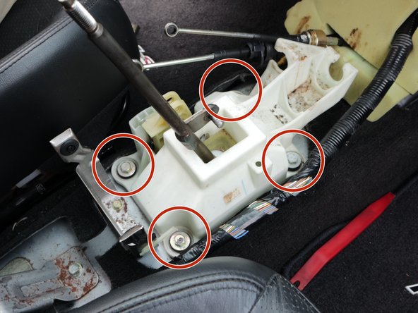 Locate the four mounting bolts.