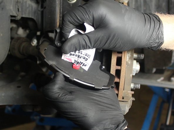 Apply a small amount brake pad lubricant to the back of each brake pad and to each end where the pad makes contact to the caliper.