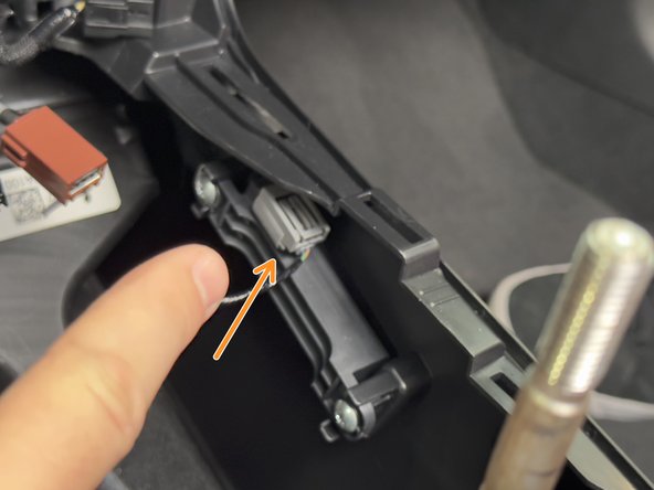 Disconnect the two connectors inside of the console.