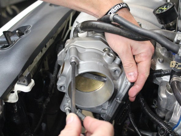 Use the longer bolts that are supplied with the kit with one lock washer per bolt to mount the ZDX throttle body to the adapter.