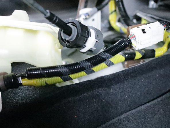 Repeat step 13 on the right-side cable. Spin the lock, slide it out and let it spin back once it is off the shifter. Keep this in mind as you will need to use the same technique to install them onto the new shifter.