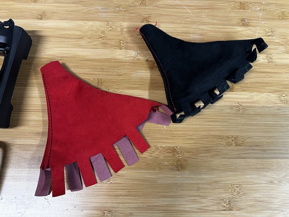 Take the Hybrid Racing shift boot and insert the ears through the OE slots in the console cover.