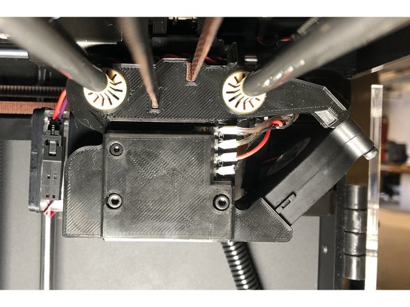 Using the included hex keys, reattach the Tool Head cover as pictured