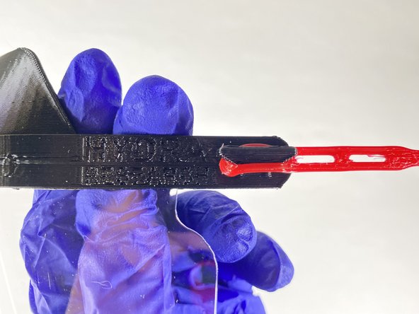 Hook the hole in one one side of the headband over the hook on the head piece.