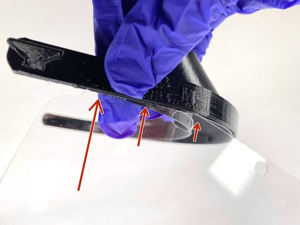 Insert the foil into the slot that goes around the front band of the head piece.