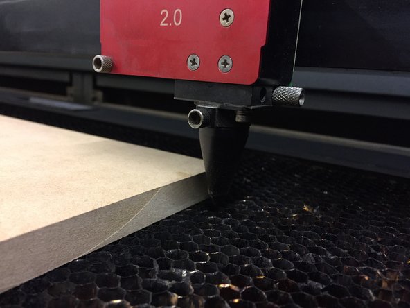 After turning on the machine, open the cover and place your media on the bed.