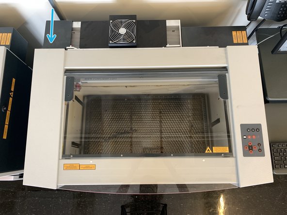 Flip the switch located on the back left side of the machine to power on.