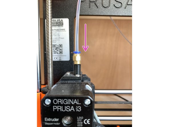 While the filament is loading, push the tube back down into the blue collet until it stops.