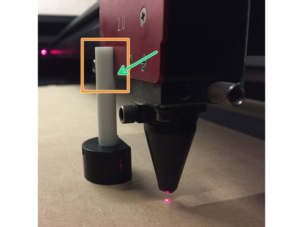 Observe the space between the angled lower edge of the focus tool's face and the bottom of the carriage.  If you cannot contact the face of the carriage with the flat face of the focus tool, the table must be lowered more.