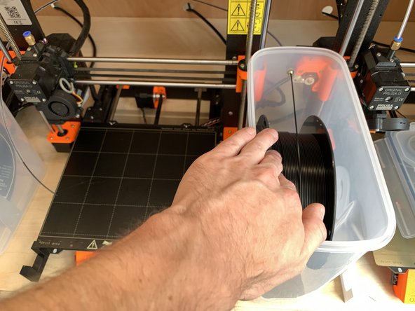 Wind the filament back through to tube and onto the reel until it is free of the tube.