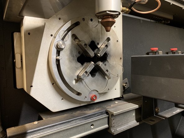 After moving the table to its second position, look to the round work holding chuck to your left.