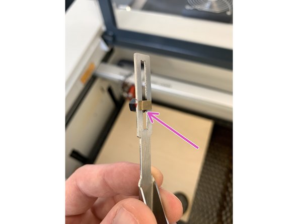 If the cutting head is clear of your media but still not enough to hang the focus tool, drop the bed slightly using the DOWN arrow key until it provides enough clearance.