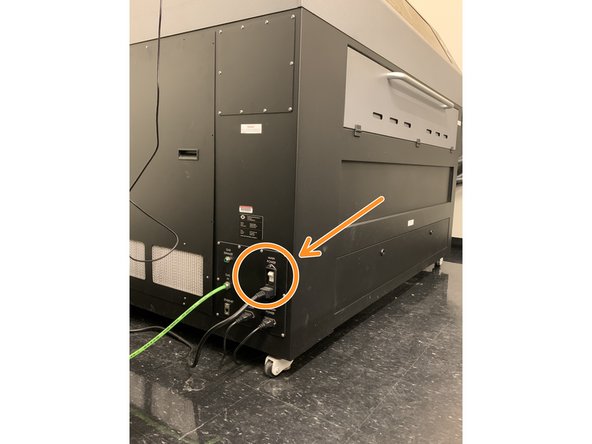 On the lower left side of the machine you will find the power switch.  Activate it to power on the machine.