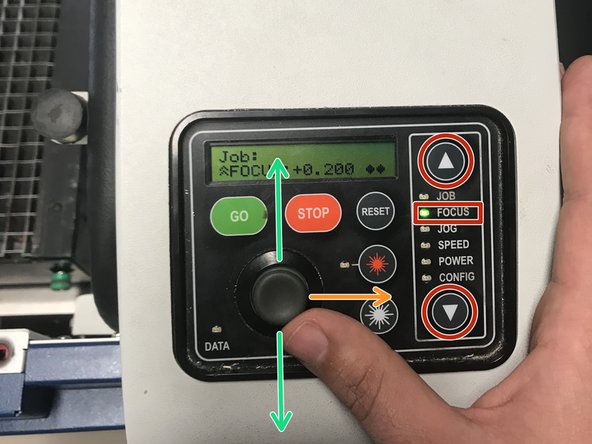 Select FOCUS using the menu arrows on the right side of the laser.