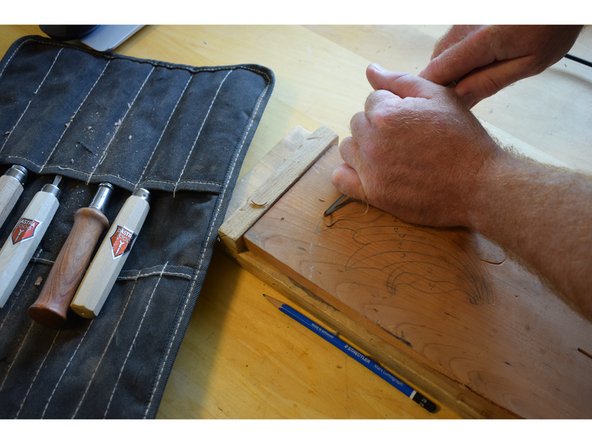 Start out with a small &quot;u&quot; gouge, follow your outline.  Cut the low parts of your outline in. This will give you an easy to see outline to start.