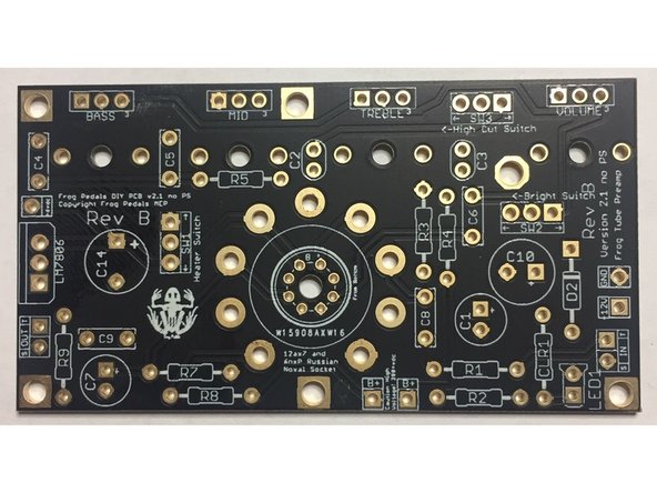 This is your board. Each hole represents a lead where a component will connect, and the white outlines/markings correspond to each component in the kit.
