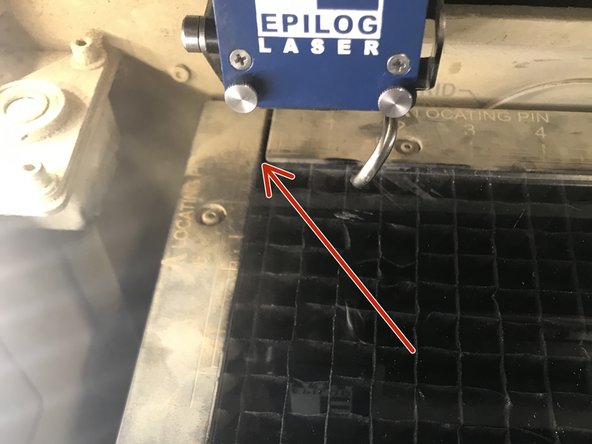 Place your material in the laser on the edge of the bed