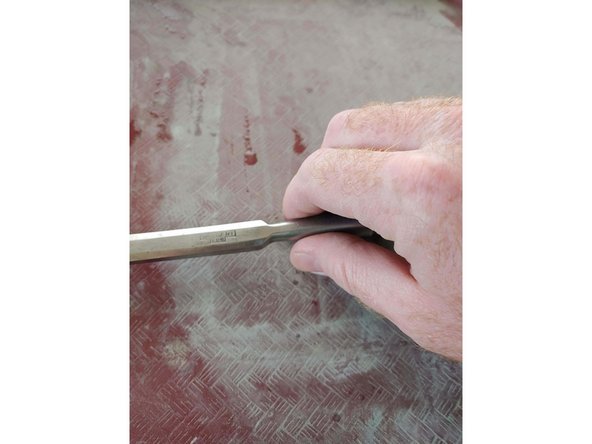 Brand new chisels will not be flat on the back!!! The good news is it only has to be done once! Use coarse grits to start, if you are using sandpaper you can go as coarse as 220, if you are using stones use the coarsest one you have. You only need to flatten the first inch or so of the back, more is fine but takes time.