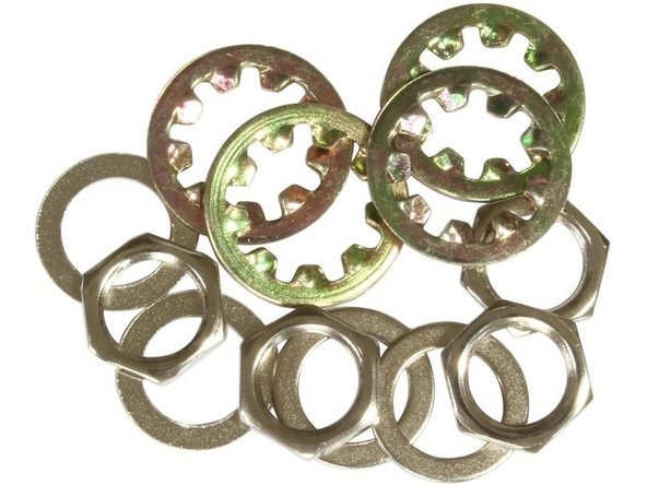 There may be a washer or rubber ring on the component, which should be installed on the inside of the enclosure touching the wall.