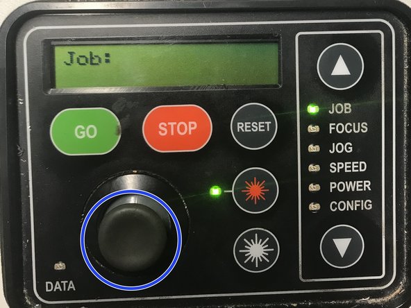 Move the laser with the joystick the the corner of your material.