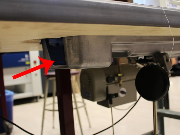 Insert the bobbin casing into the bobbin holder underneath the machine