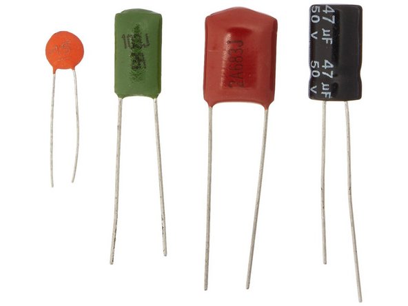 Film Capacitors: Wide-flatties. There are usually values written on the sides of the capacitor. Give those numbers a google and it’ll tell you what value they are.