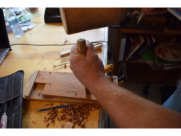 Set it in place and give it a single rap with the mallet. A single hit will be more accurate than multiple and you don't want to go so deep that you end up splitting the piece.