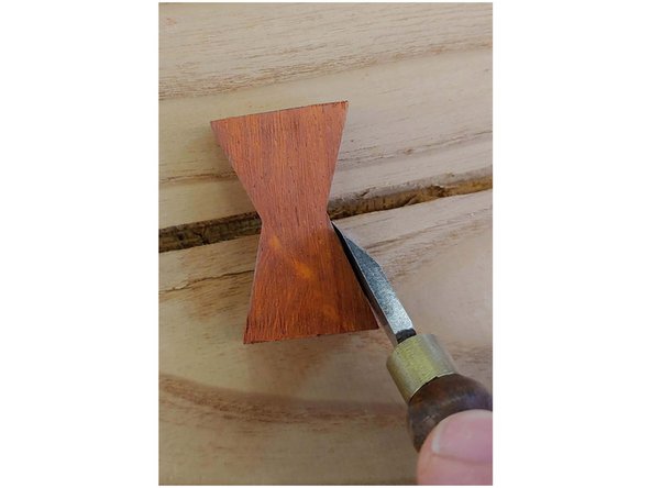 Use the marking knife to trace out the part, a sharp pencil will also work for this. I like the marking knife: the flat back ensures you are right up against the part you're tracing, and the cut it makes gives a registration point for the chisel.