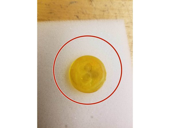 The Len's Holder holds the Lens of the Epilog Laser.  The Len's looks like a clear, yellow, round piece of glass. The actual laser of the Laser Engraver travels through this lens when making cuts/rasters/engravings