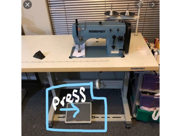 On the floor under the machine there is the foot presser. The rectangular button will activate the machine and start sewing the fabric under the needle. The more pressure the faster the needle will puncture the fabric.