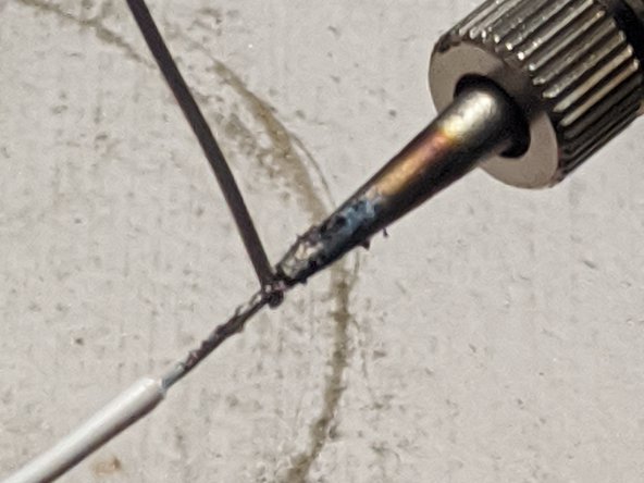 Strip a ¼ inch section on each side of the wire.