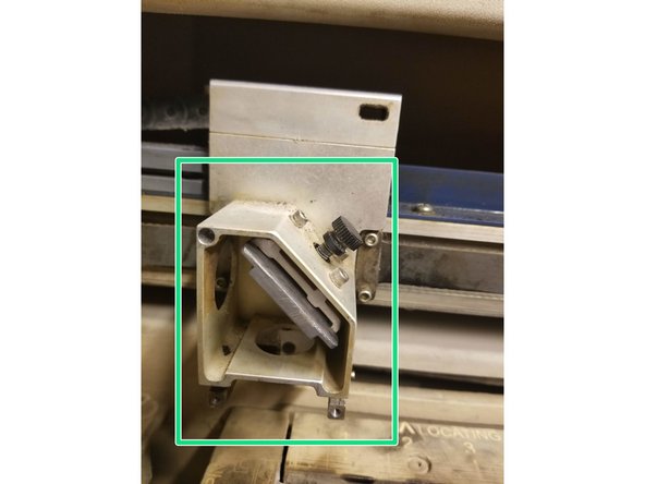 Take out Len's Holder, which contains the  Epilog Laser Len's on the inside