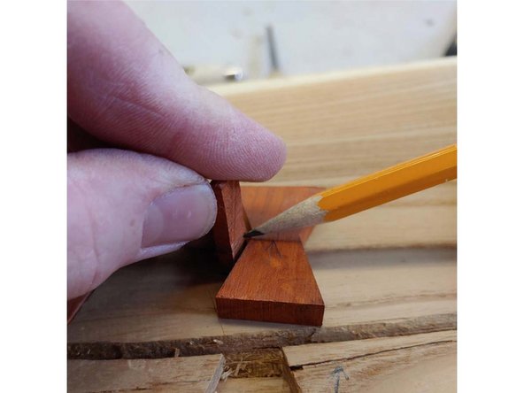 Make a depth gauge I just used a scrap from the band saw. Hold it perpendicular to the butterfly, mark it with a pencil then set it in the pocket to check depth, keep repeating step 5 until the line just matches.