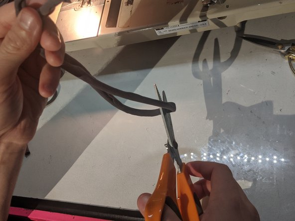 Cut it into two strips and measure the length around your ears and cut them to that length.