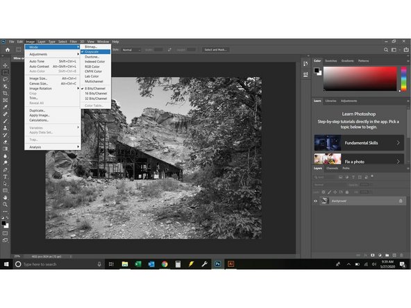 Click Image =&gt; Mode =&gt; Grayscale. You will see a prompt that says &quot;discard color information?&quot; select 'yes'.