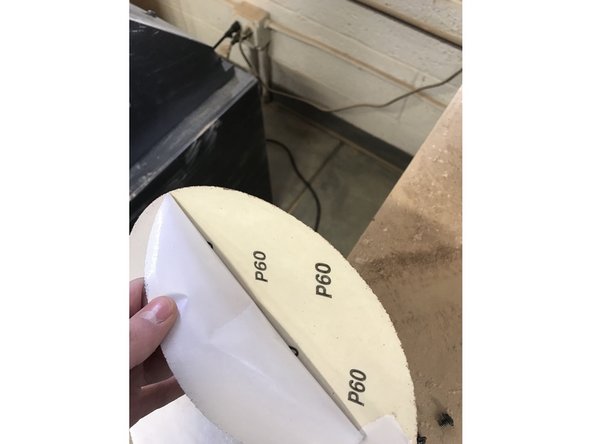 Peel the backing off the new disc to expose the adhesive.