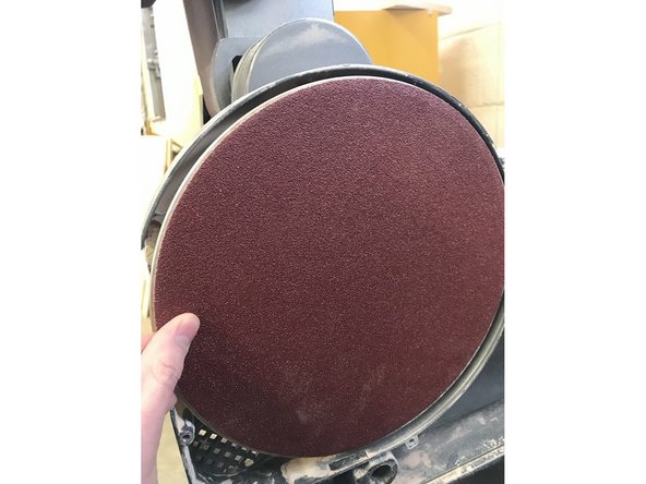 Press the disc onto the machine, making sure it is as center as possible. Press firmly all around to ensure that it is adhered everywhere.