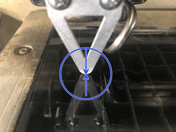 Use the joy stick to move the laser up and down.