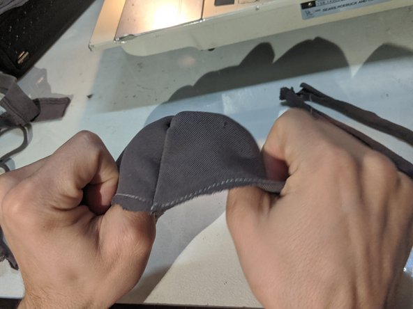 Flip the mask inside out and trim up any loose fabric that might irritate your face.