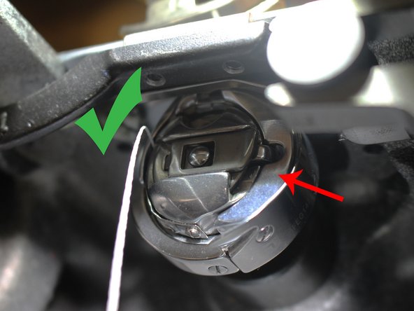 You will know the bobbin casing is correctly inserted once it clicks into place