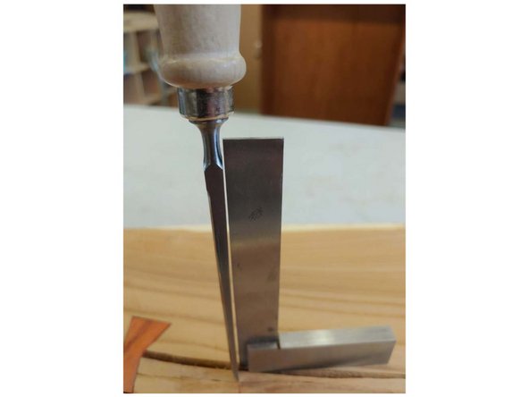 A single strike from a mallet is all that is needed. If you go too deeply the wedge shape of the chisel will make a groove that is too wide.