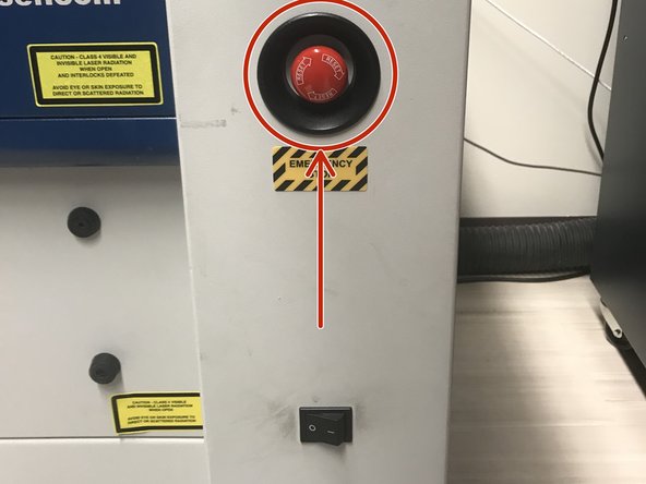Press the Emergency Stop circled in red if there is a fire or any other emergency.