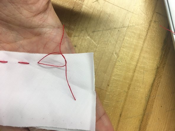 Separate the two threads and tie them twice.