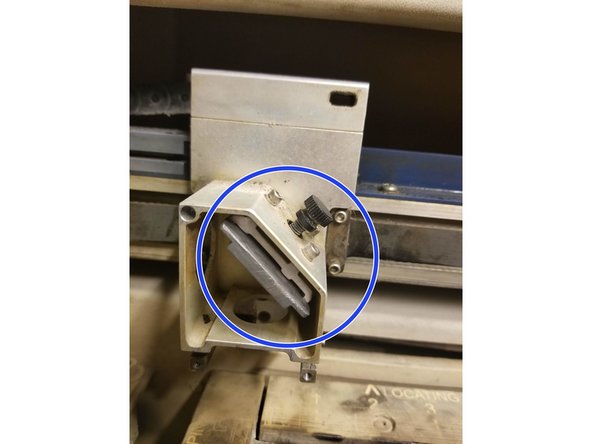 Screw big black screw back into place.  Screw it tight enough for the mirror to stay in place- if screwed too tightly the mirror can crack