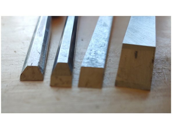 From left to right a dovetail chisel, bench chisel, socket firmer chisel, and heavy mortising chisel                                                  The type of chisel refers to the profile of the blade and the construction. So a Socket Firmer chisel would be socket construction with a firmer blade.