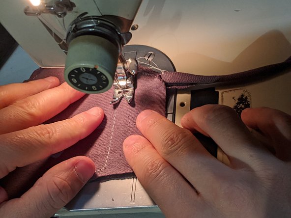 Continue until you meet the outline stitch. Turn 90 degrees and work your way back to the top. Turn again and sew until you meet your first strap.