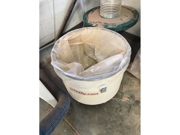 Once the bin is out, you can see how much sawdust has accumulated. If it seems the machine has been overflowing, you may need to pull more out of the machine that has been clogged up.