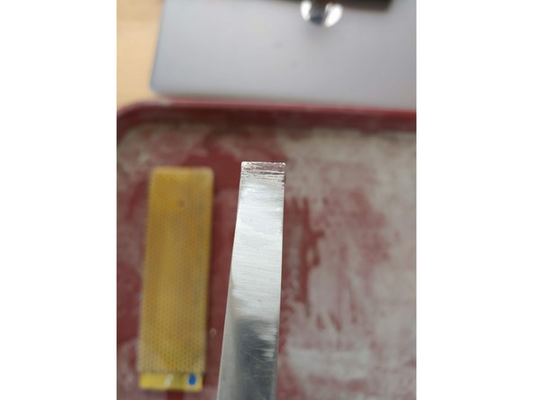 Check the progress in raking light: Hold the blade angled away from you and twist it in the light. You will be able to see your new coarse scratches from the old surface finish.